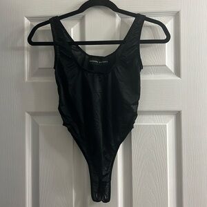 Barbara Bologna - Black, sheer bodysuit. NWOT. Size S.